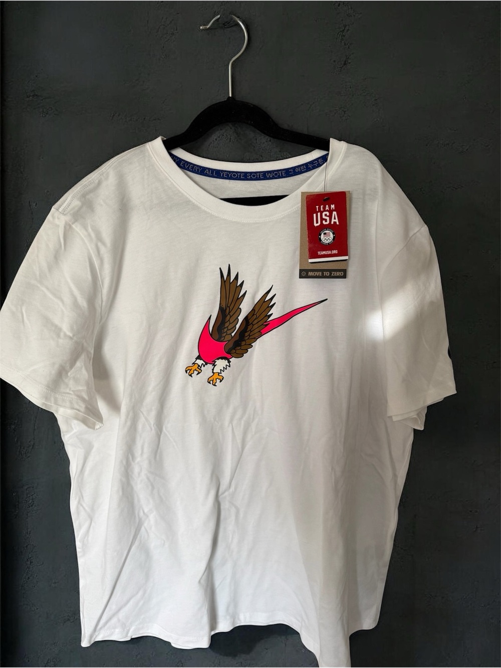 Nike White Short Sleeve T-Shirt with Pink & Brown Eagle Graphic